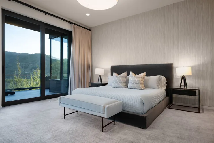 Guest suite with bench seating and floor-to-ceiling glass
