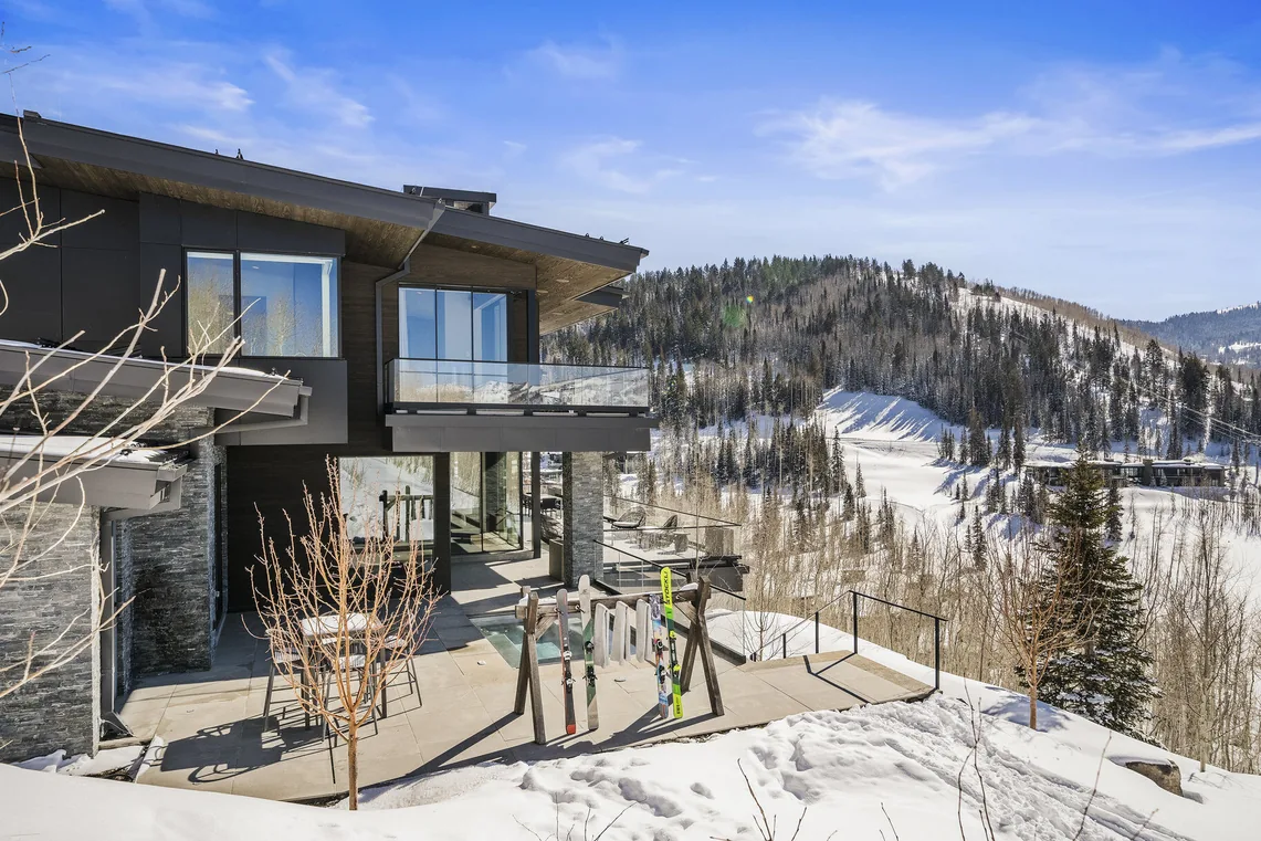 Winter exterior with private ski patio and slopeside access