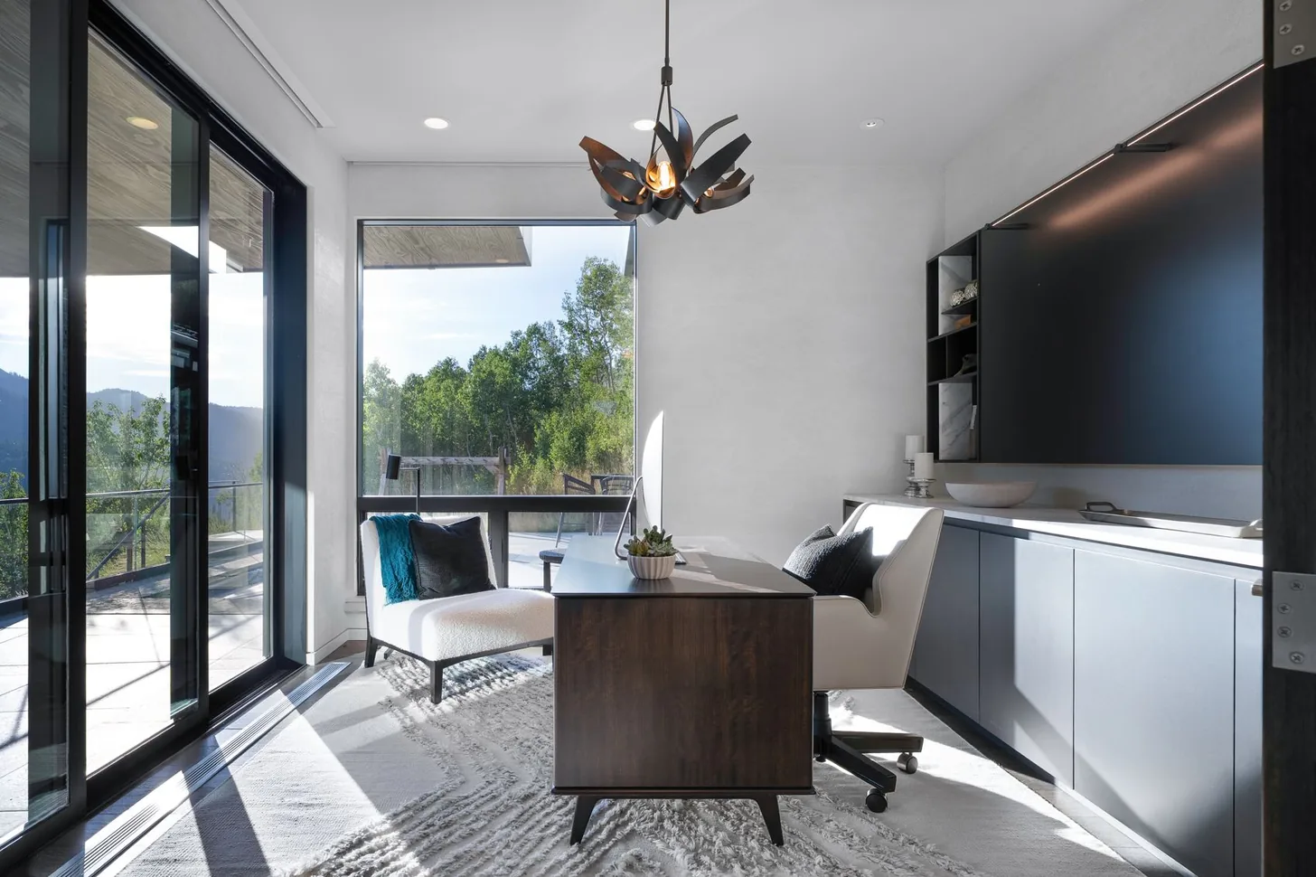 Main-level office with sliding glass doors opening to the patio