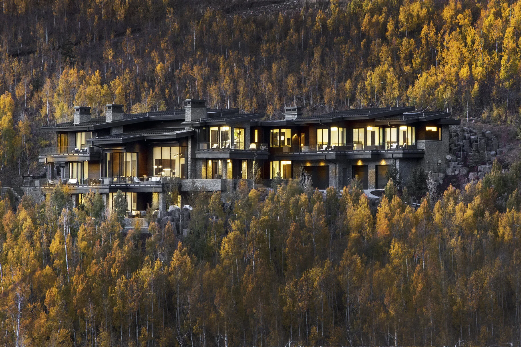 Aerial autumn view of 246 White Pine Canyon Road set into the aspen-covered mountainside